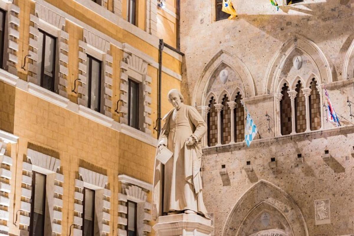 uma estátua de um homem em pé em frente a um prédio