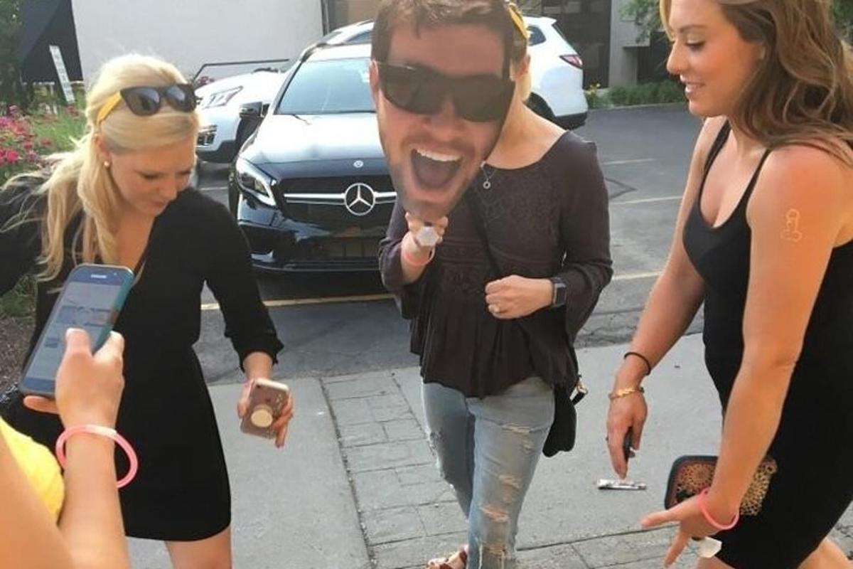 a man and two women walking down the street