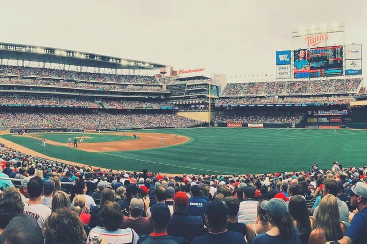 a large crowd of people watching a baseball game