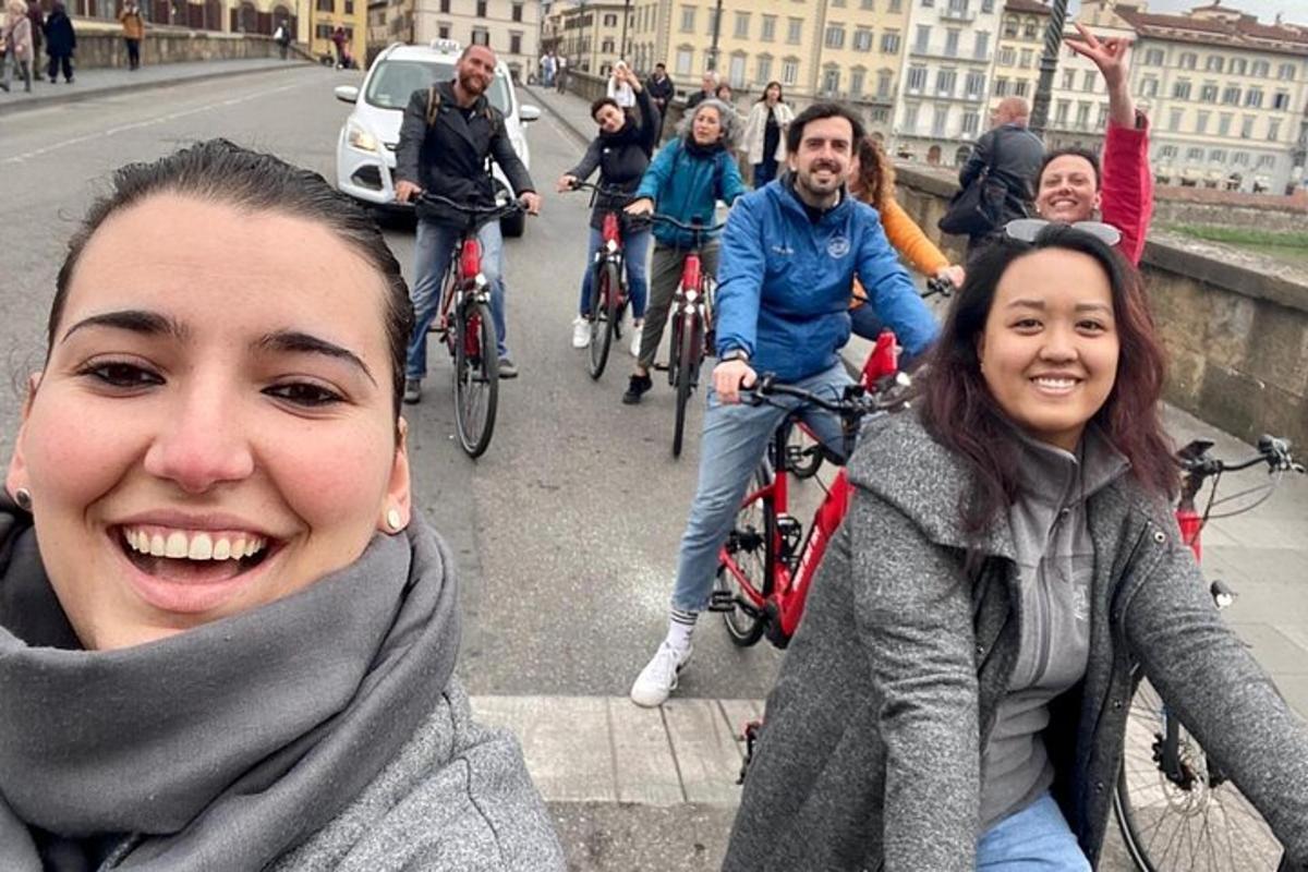a group of people riding bikes on a bridge