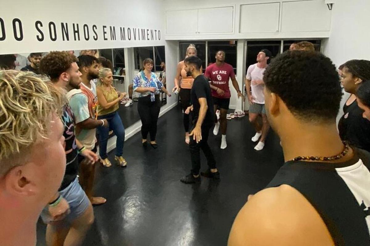 a group of people standing around in a room