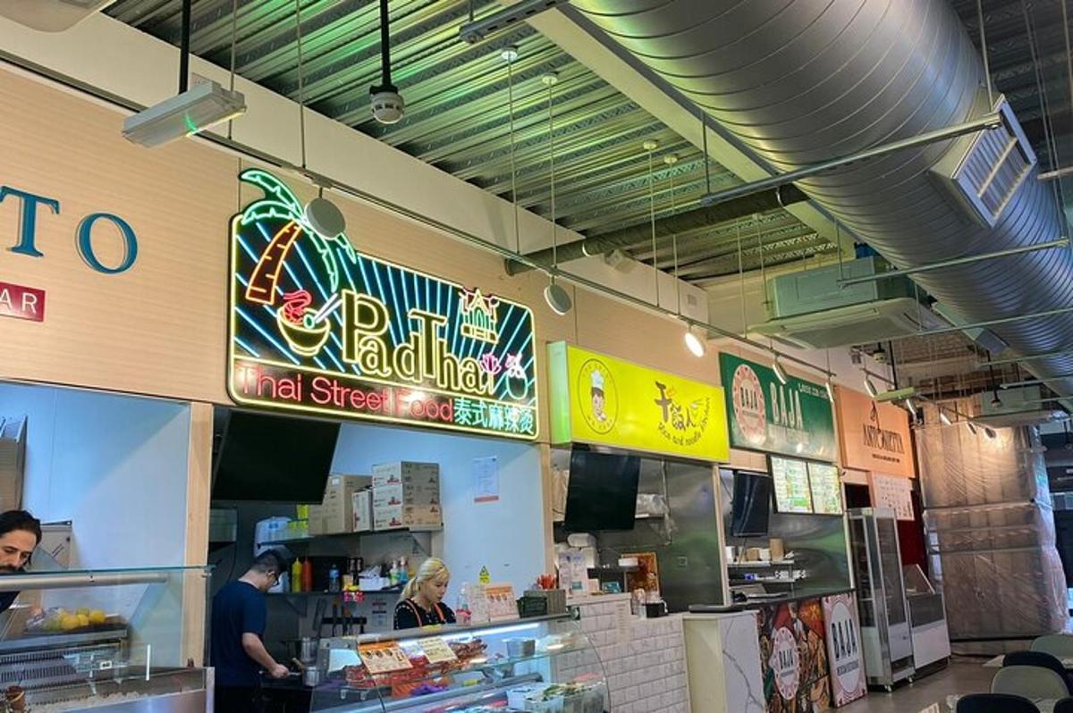 a fast food restaurant with a man preparing food