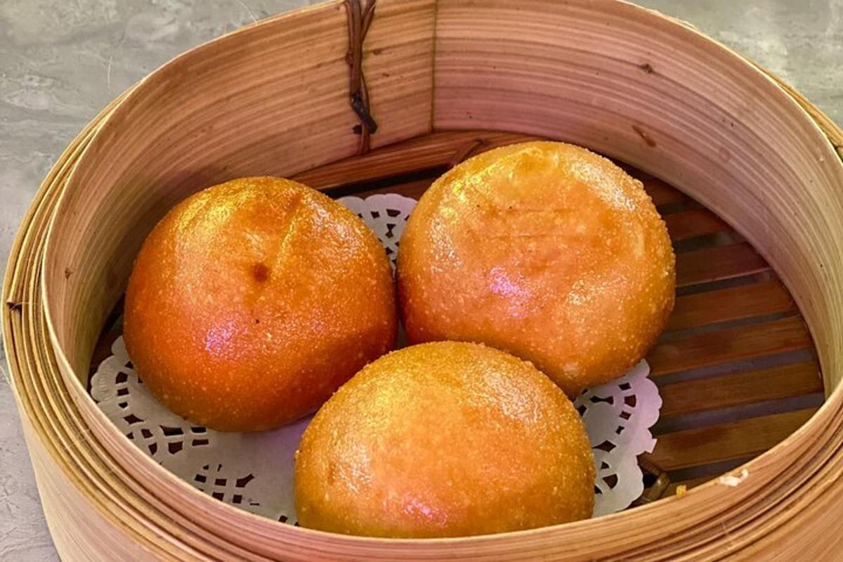 a basket with three rolls in it