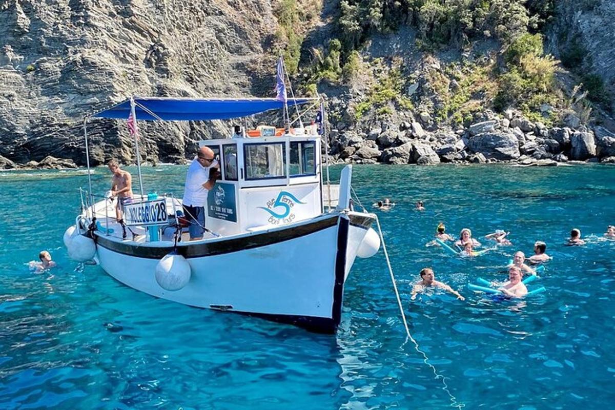 a group of people in the water on a boat