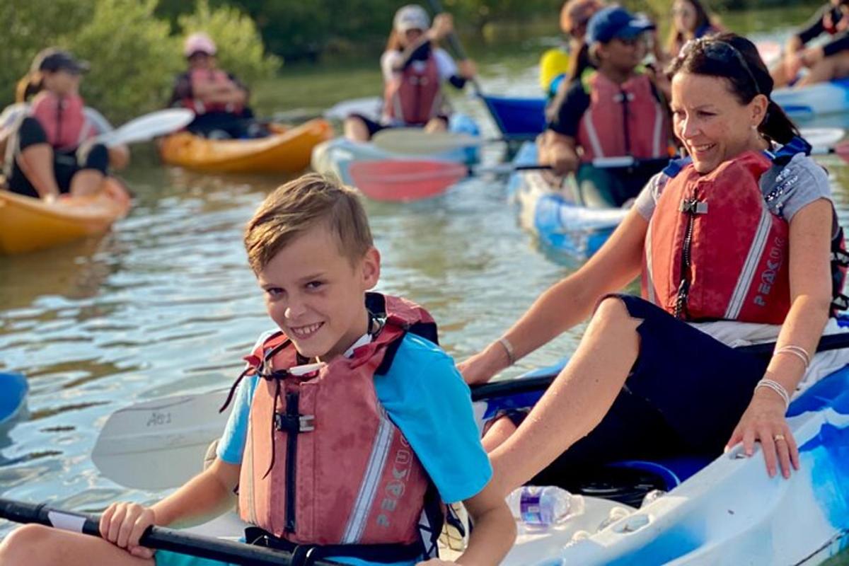 a group of people in kayaks on the water