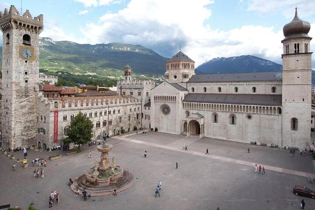 a large building with a fountain and a clock tower