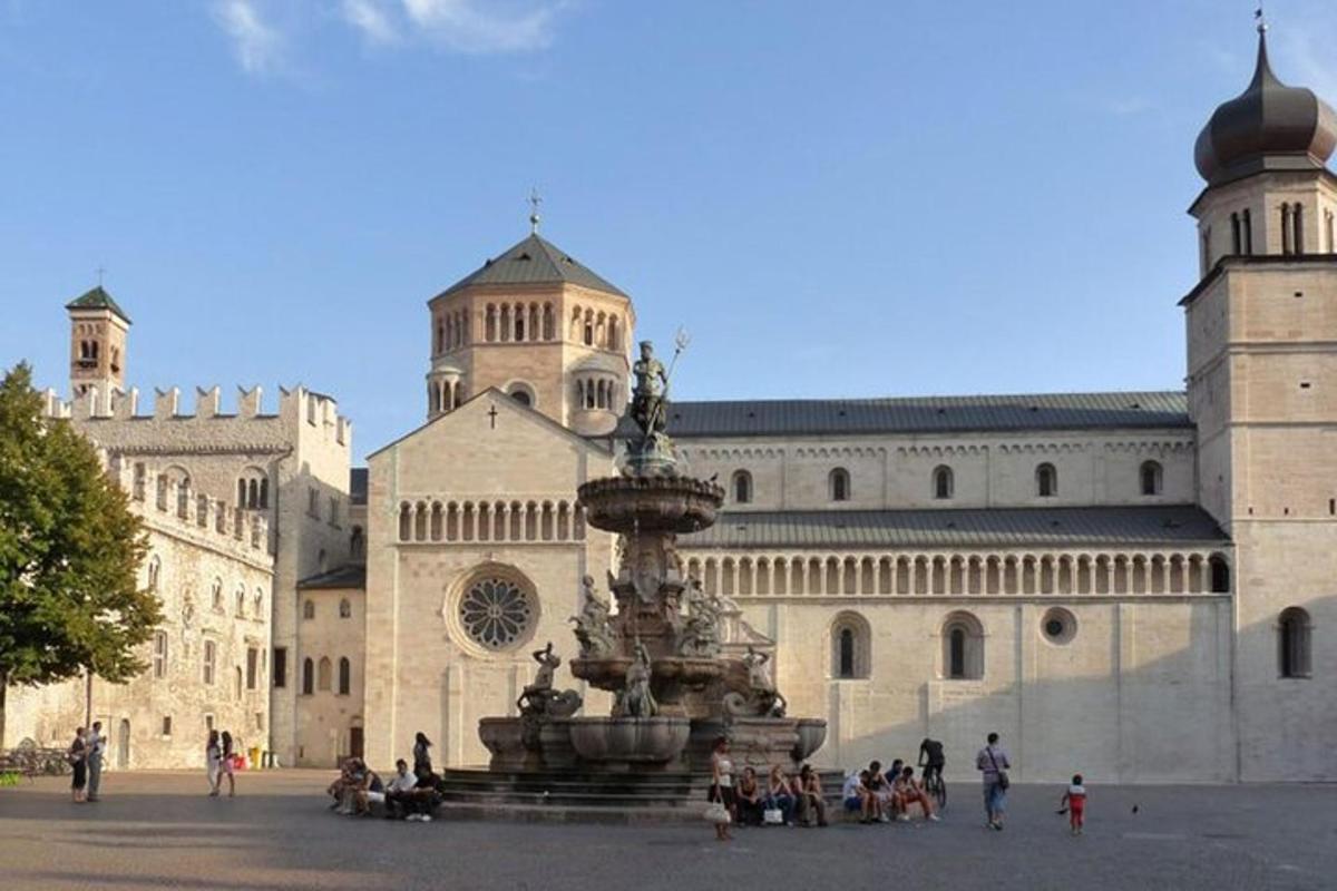 a large building with a fountain in front of it
