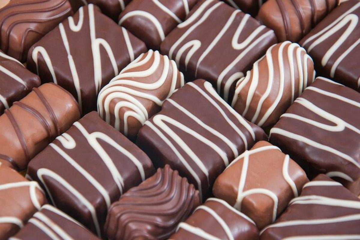 a close up of a pile of chocolate covered marshmallows