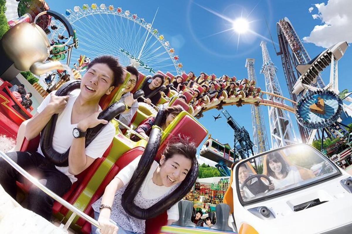 a group of people riding on a roller coaster at a carnival