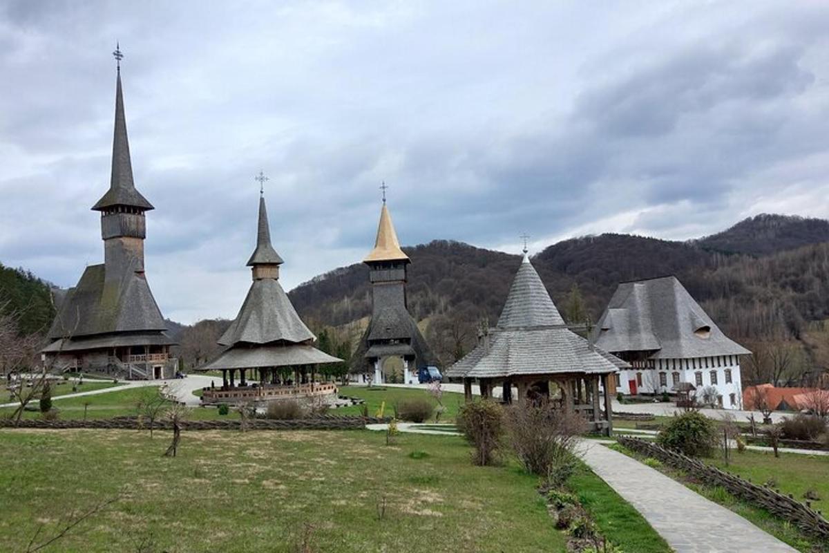 a group of buildings with domes in a field