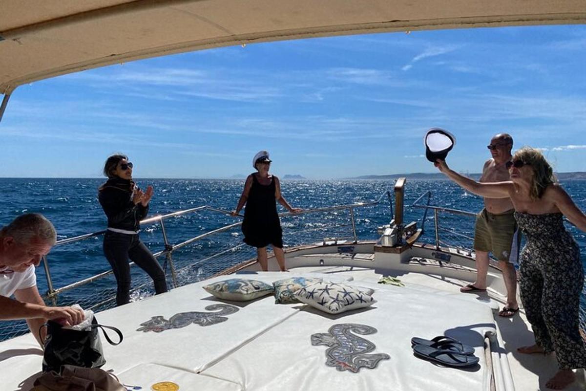 a group of people on a boat in the water