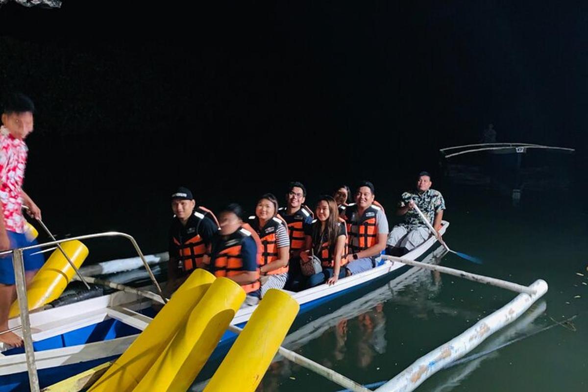a group of people on a boat in the water