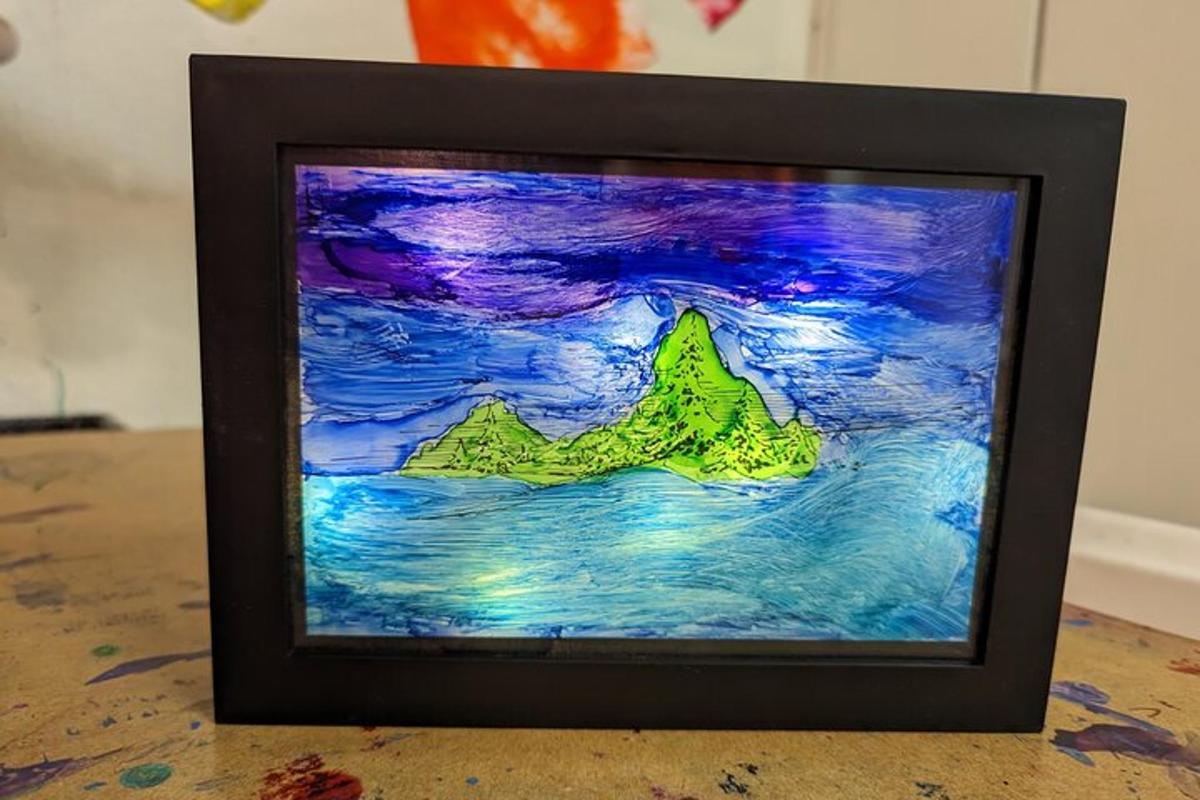 a painting of a mountain on top of a table