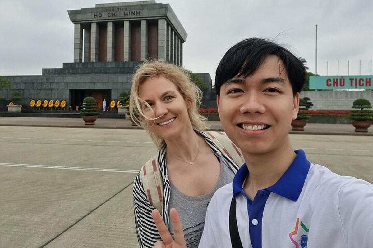 a man and a woman standing in front of a building
