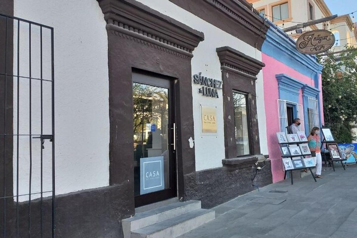 a store on a street with people in the window