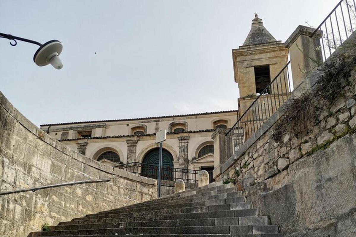 an old building with stairs and a street light