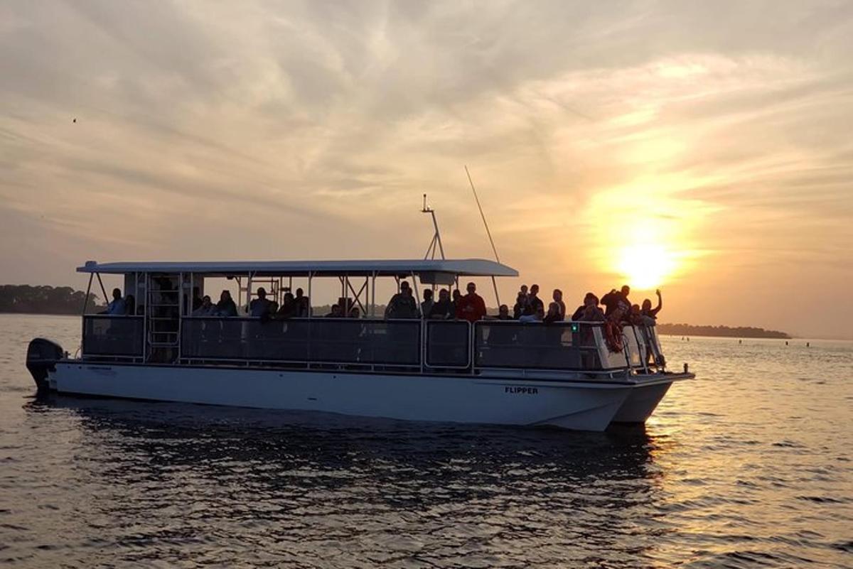 a group of people on a boat in the water