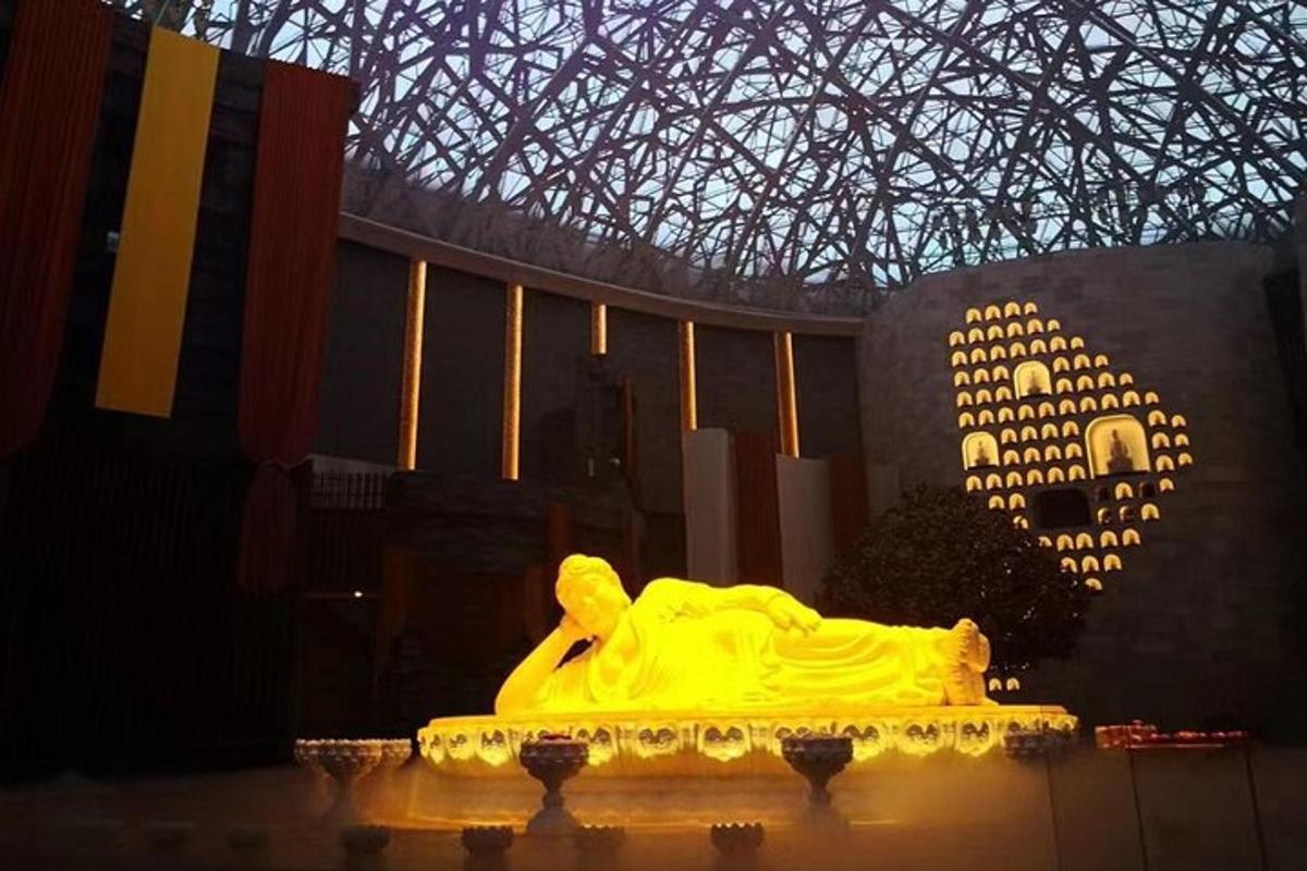 a yellow cake sitting in front of a building
