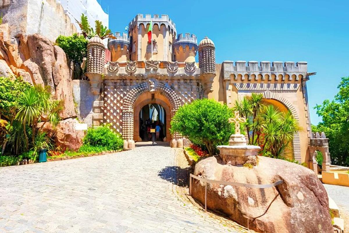 a castle with a fountain in front of a building