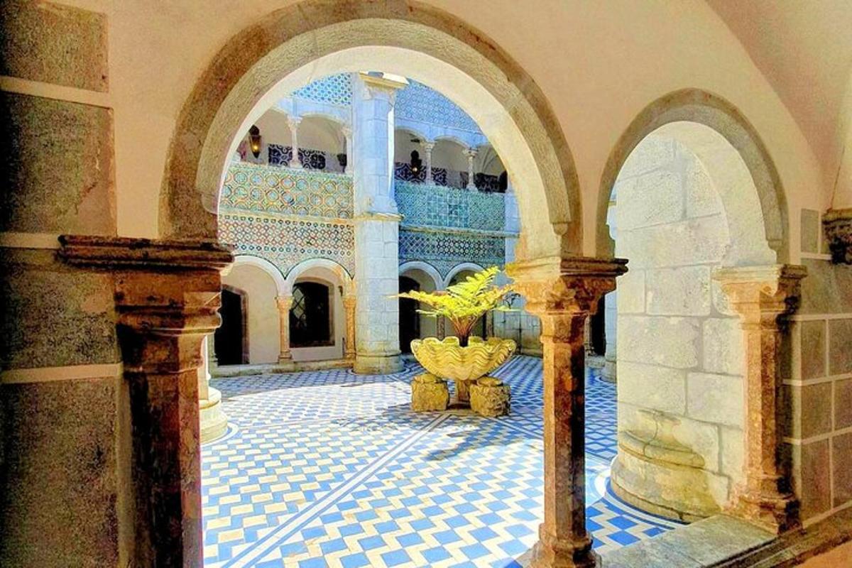 a building with a tile floor and a room with a plant