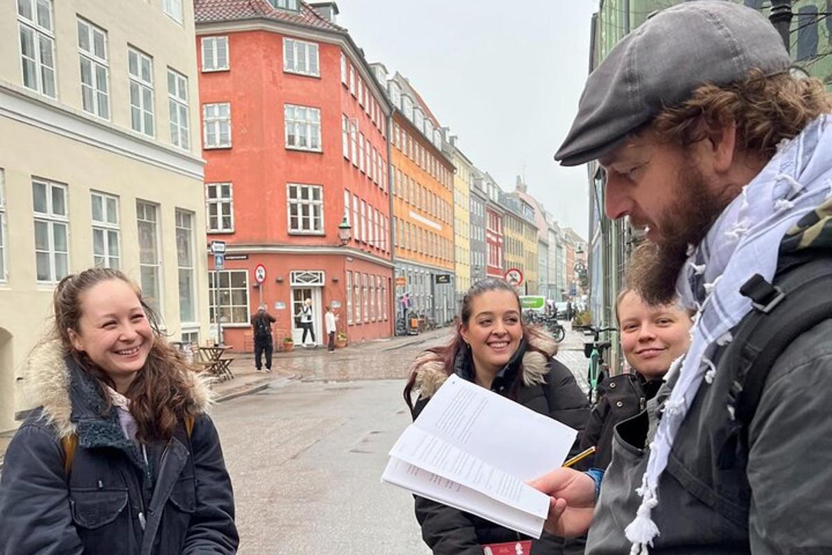 a man is talking to a group of people on a street