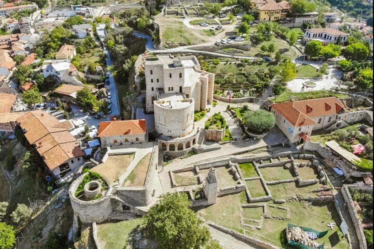an aerial view of an old castle in a city