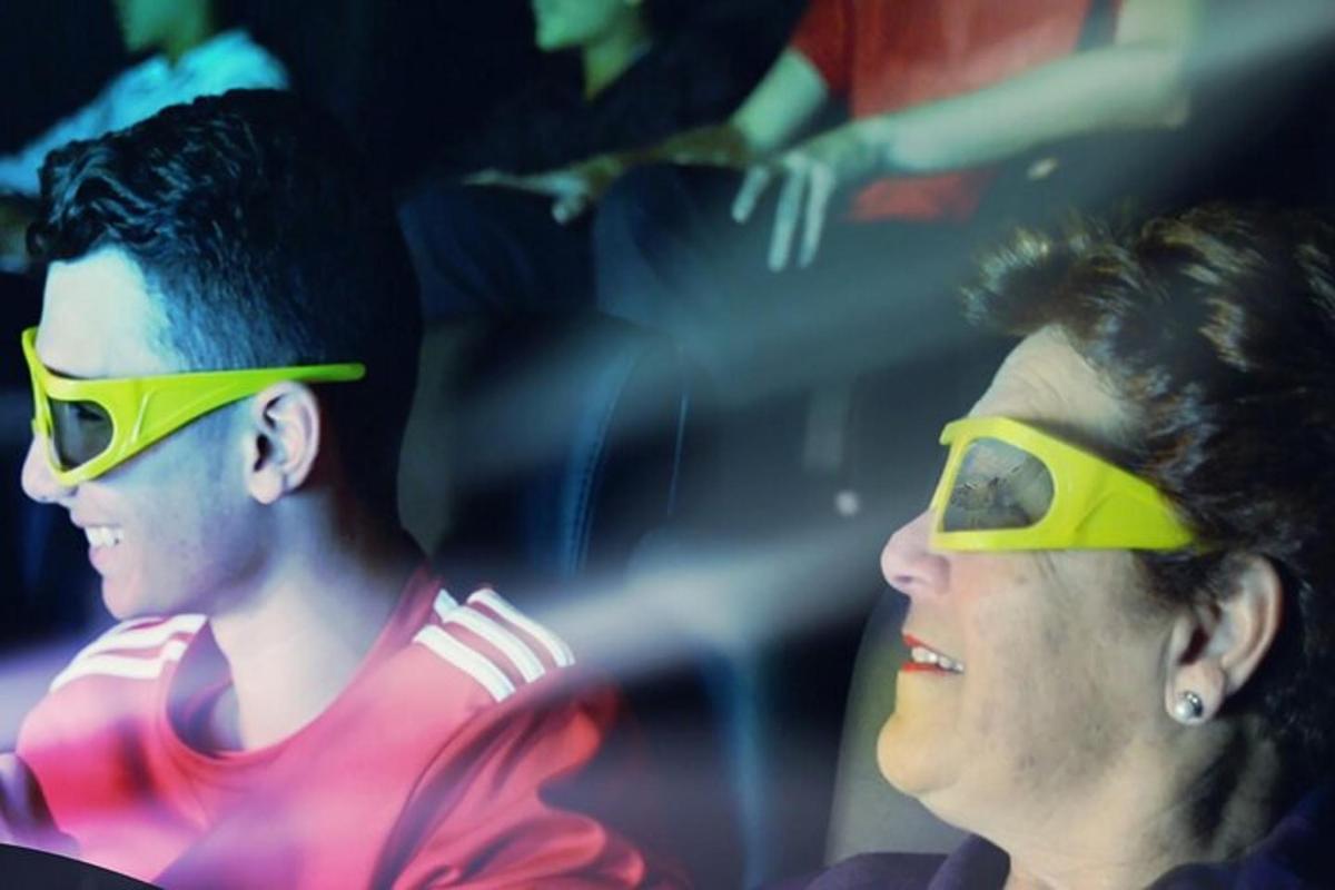 two women wearing yellow glasses in a crowd