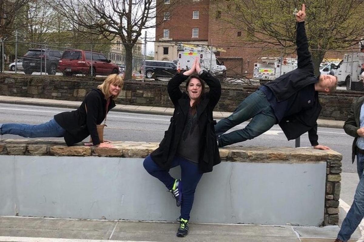a group of people jumping off of a wall