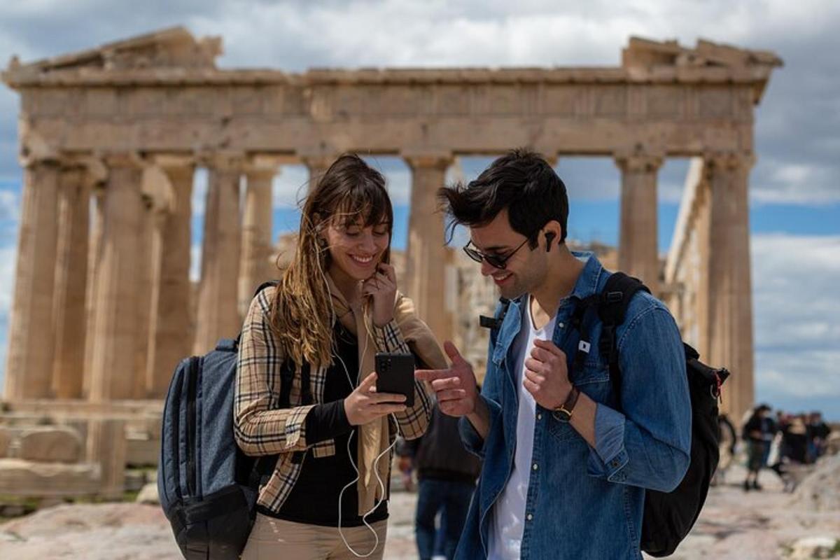 a man and a woman looking at a cell phone
