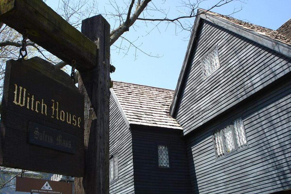 a building with a sign in front of a house