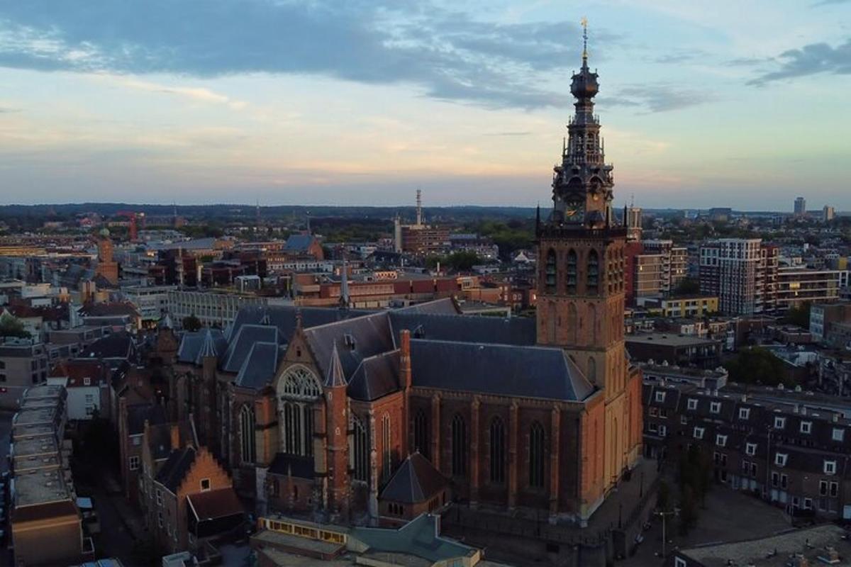 an aerial view of a large building with a tower