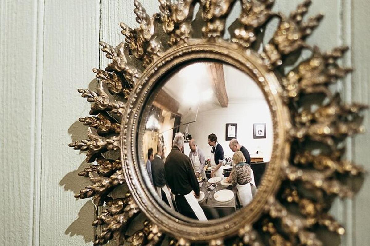 a group of people standing in front of a mirror
