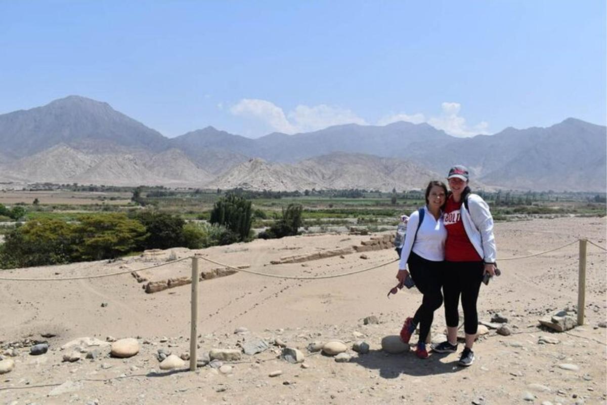a man and a woman standing in the desert
