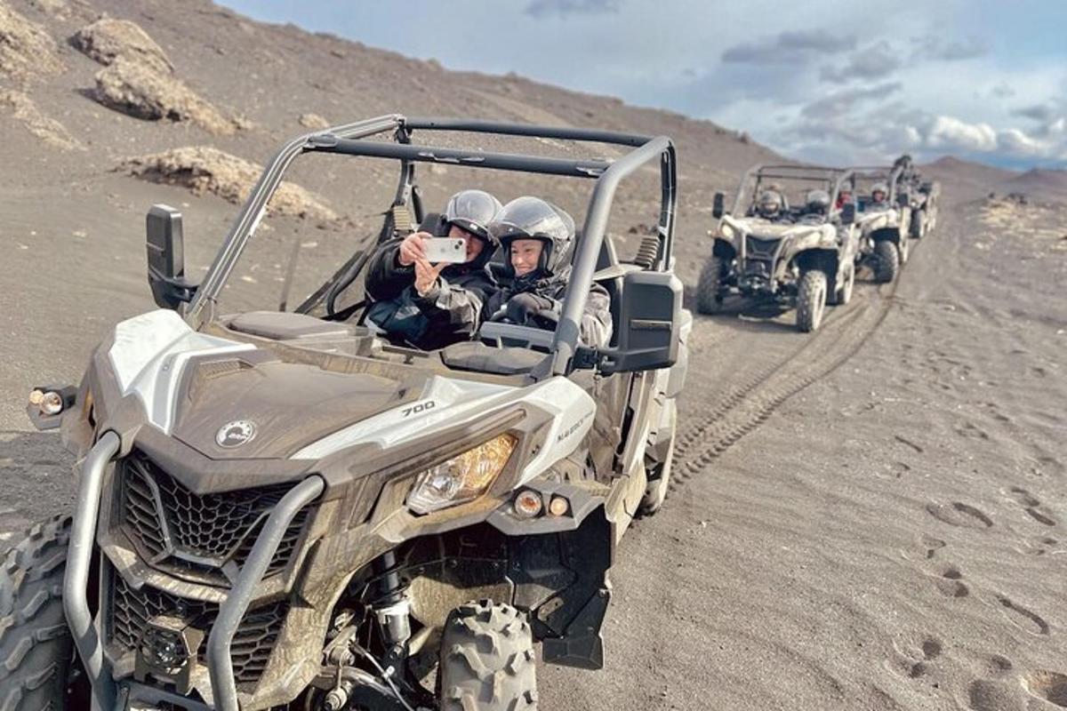 a group of people riding in atvs in the desert
