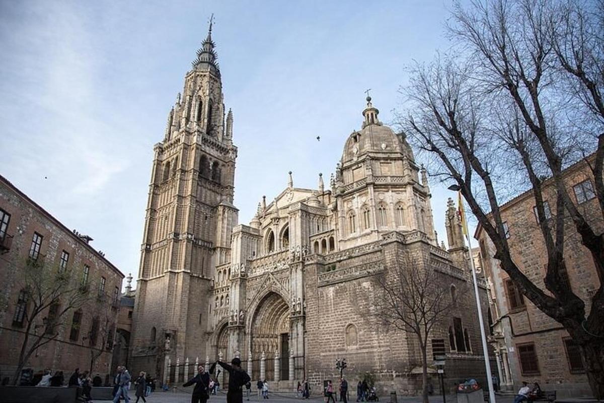 a large cathedral with two towers on a city street