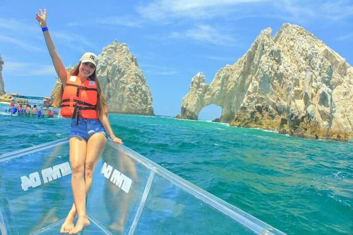 a woman sitting on a boat in the ocean