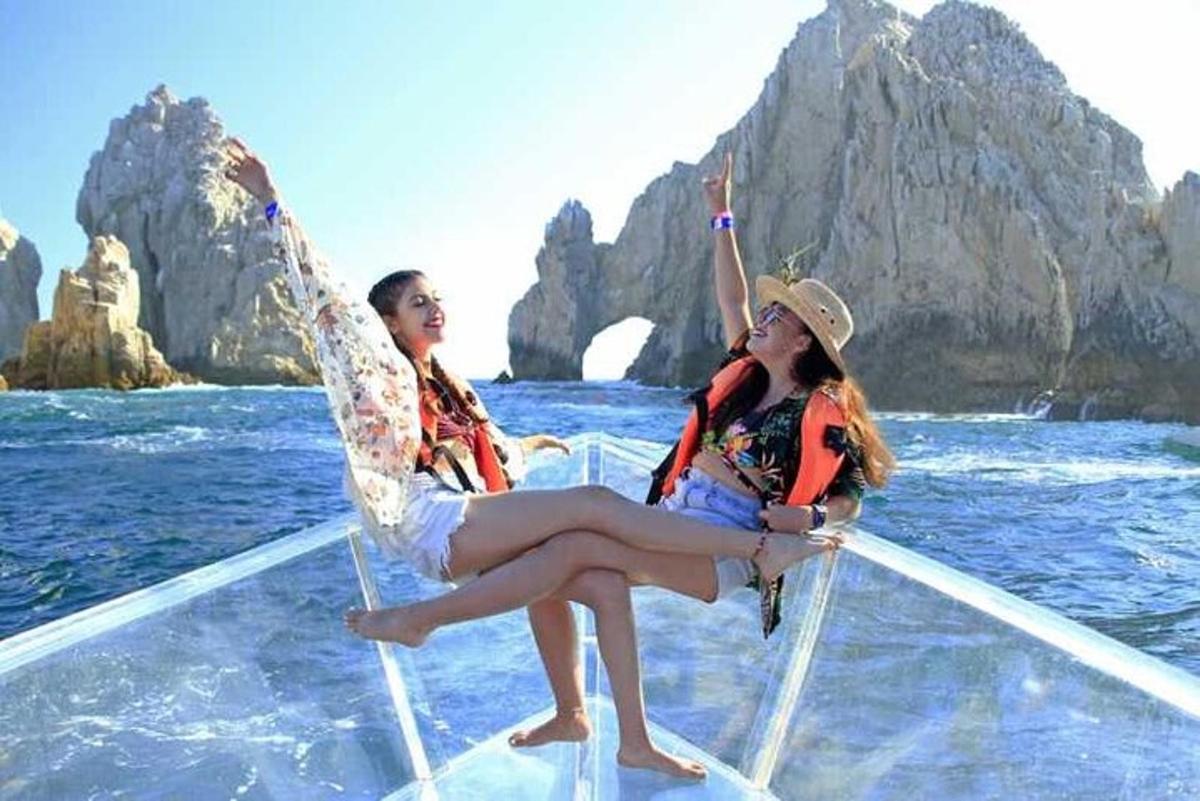 two women sitting on a boat in the water