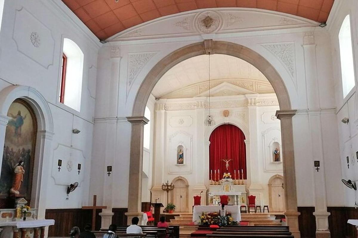 a large church with a red organ in it