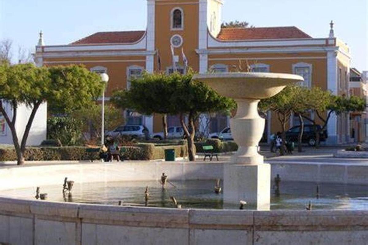 a fountain in front of a building with a building