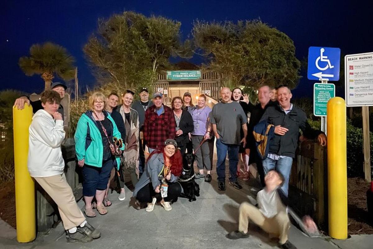 a group of people standing in front of a sign