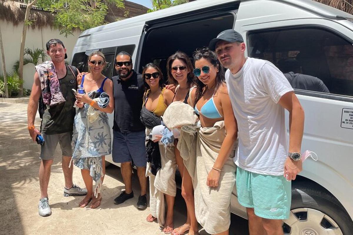a group of people standing in front of a van