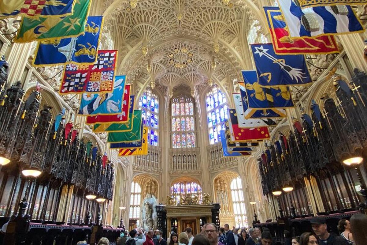 a large room with people in a cathedral with flags