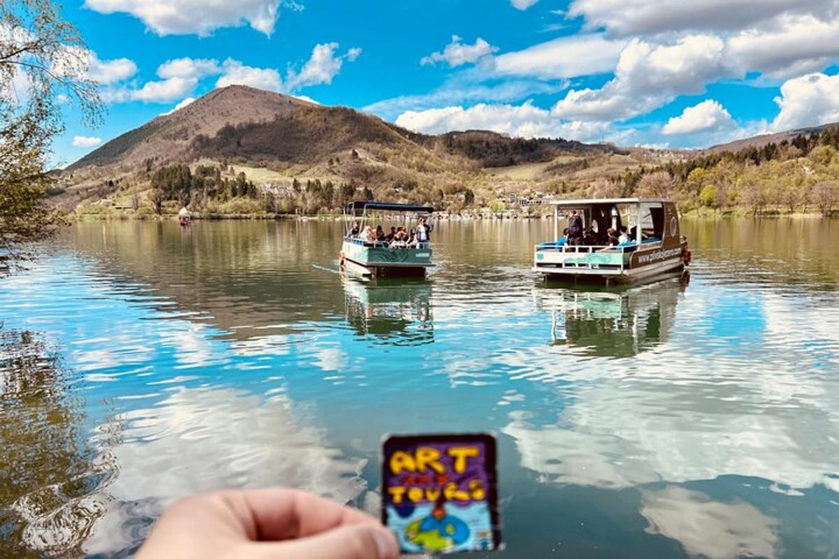 two boats on a lake with people on it