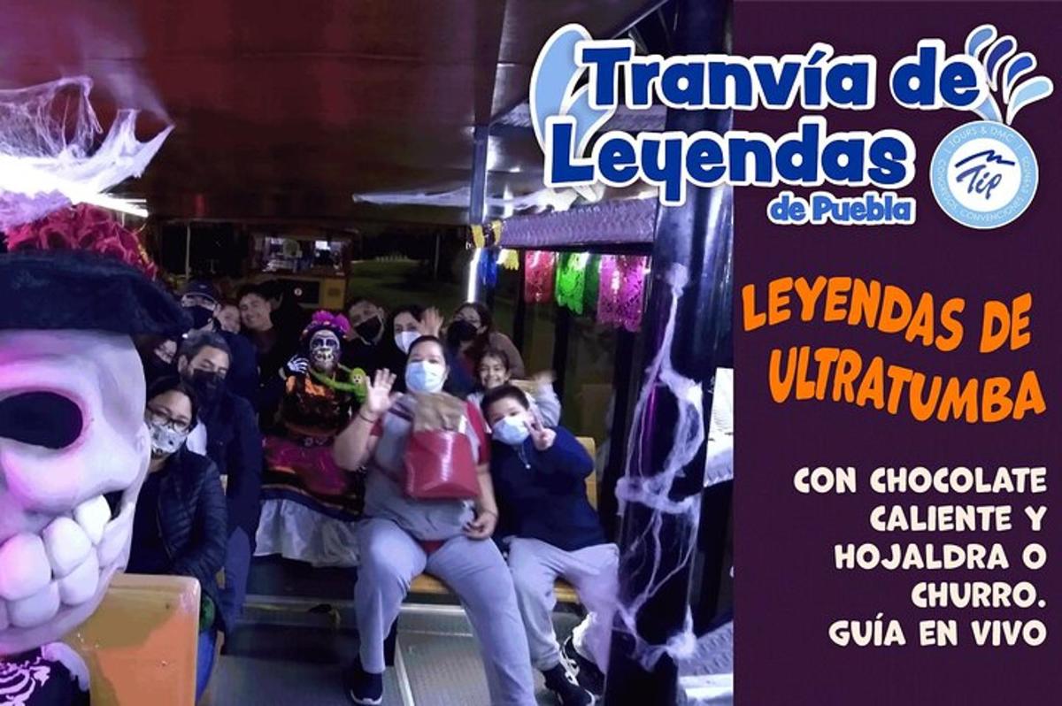 a group of people wearing masks sitting on a bus