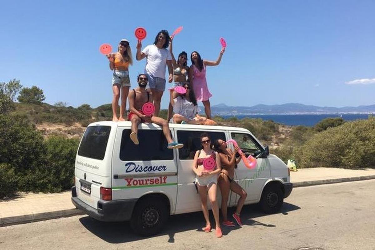 a group of people sitting on the back of a van