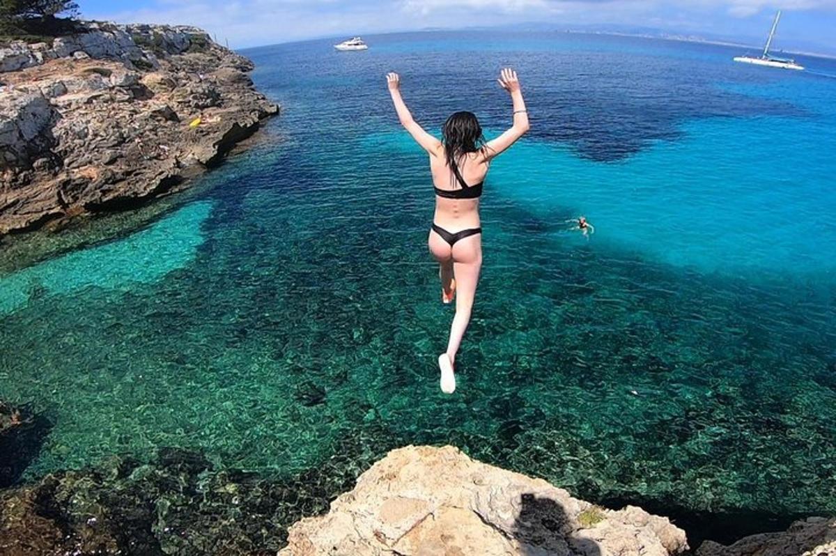 a woman in a bikini jumping into the water