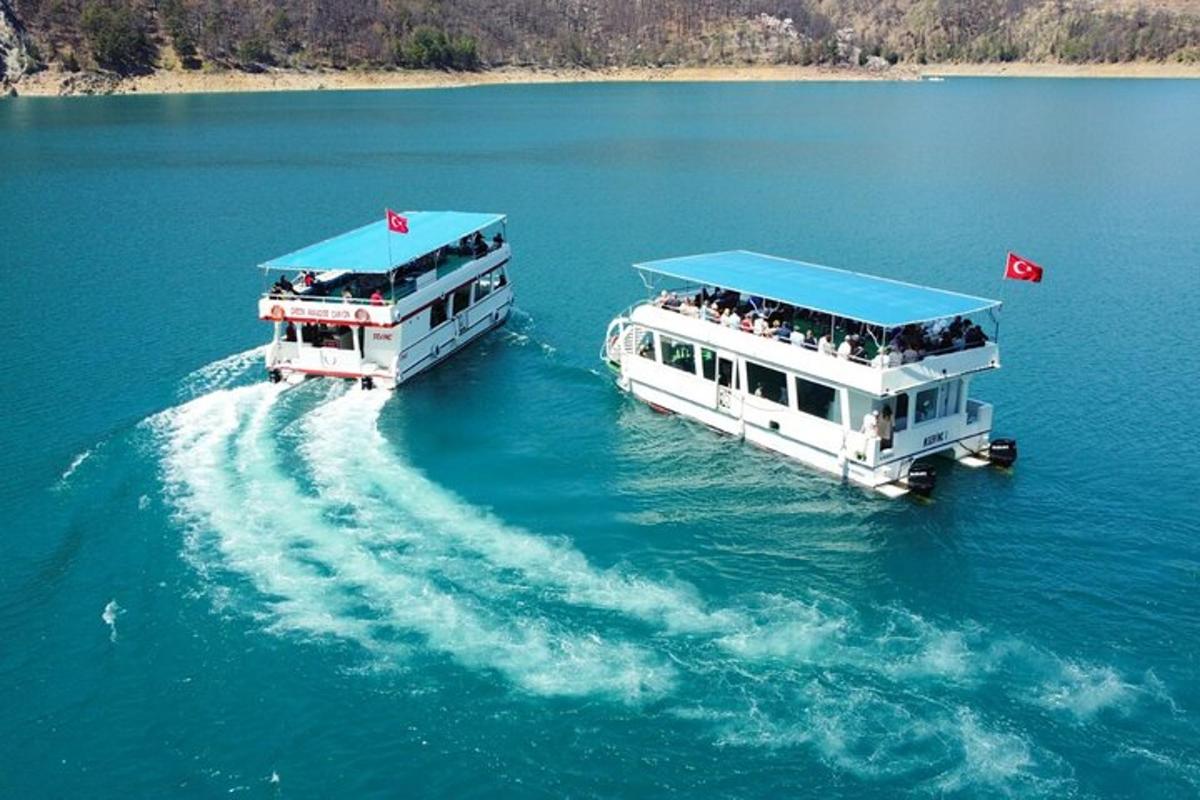 two white boats in a large body of water