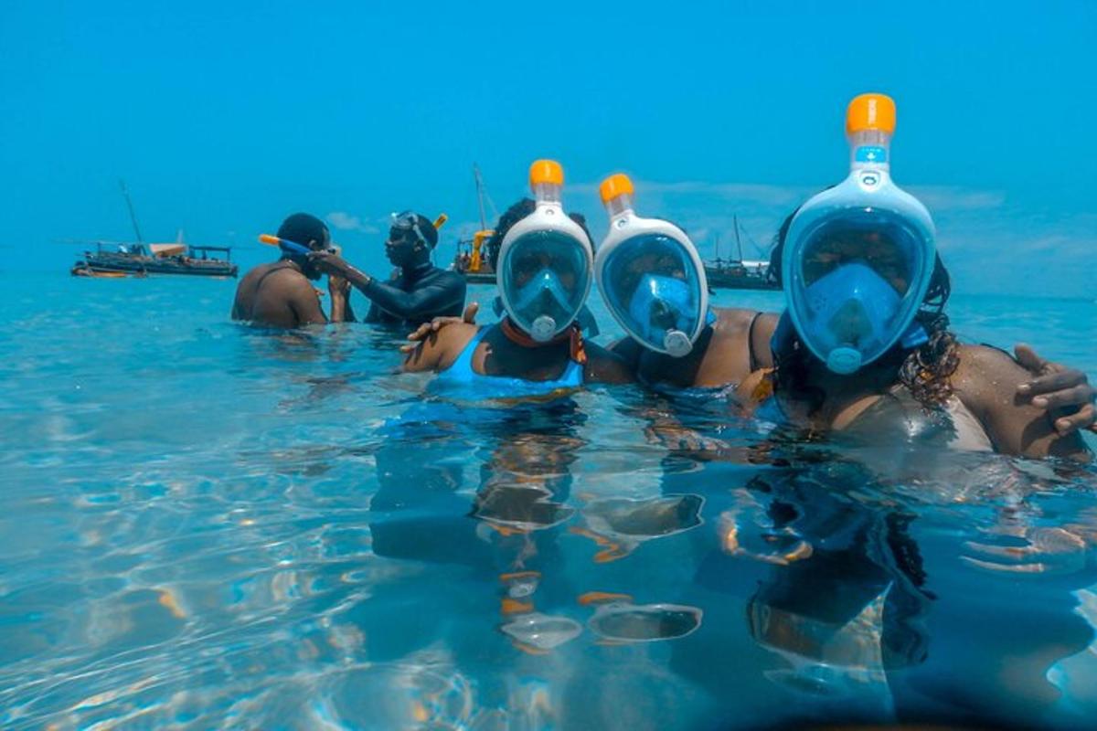a group of people in the water with bottles on their heads