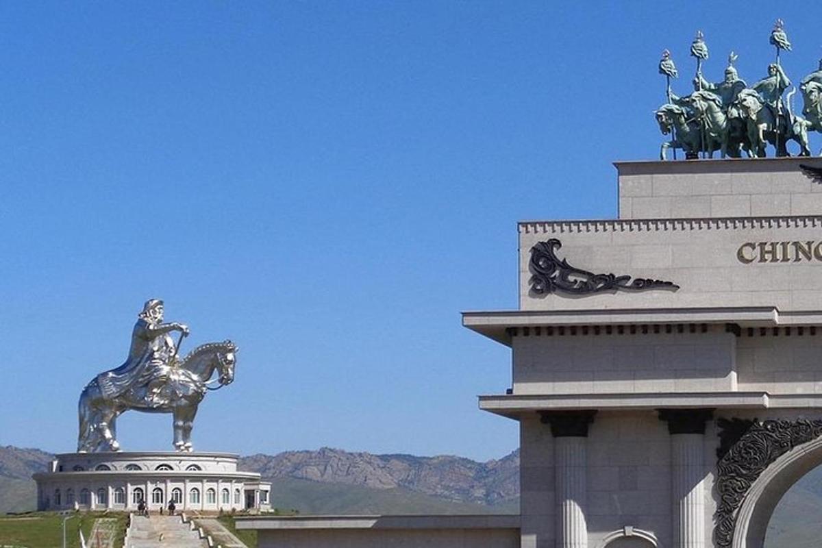a statue of a woman on a horse on top of a building