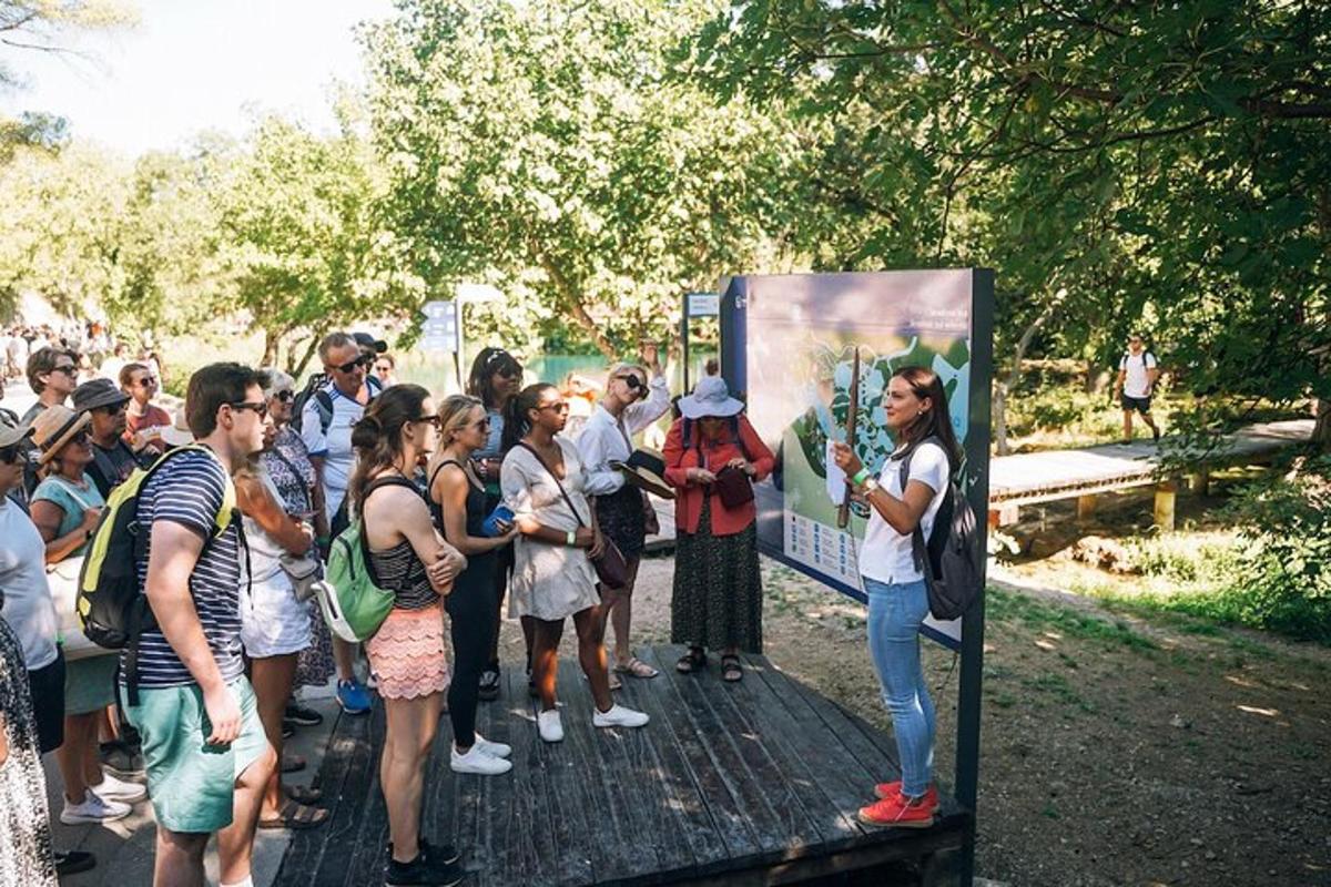 a large group of people standing around a sign
